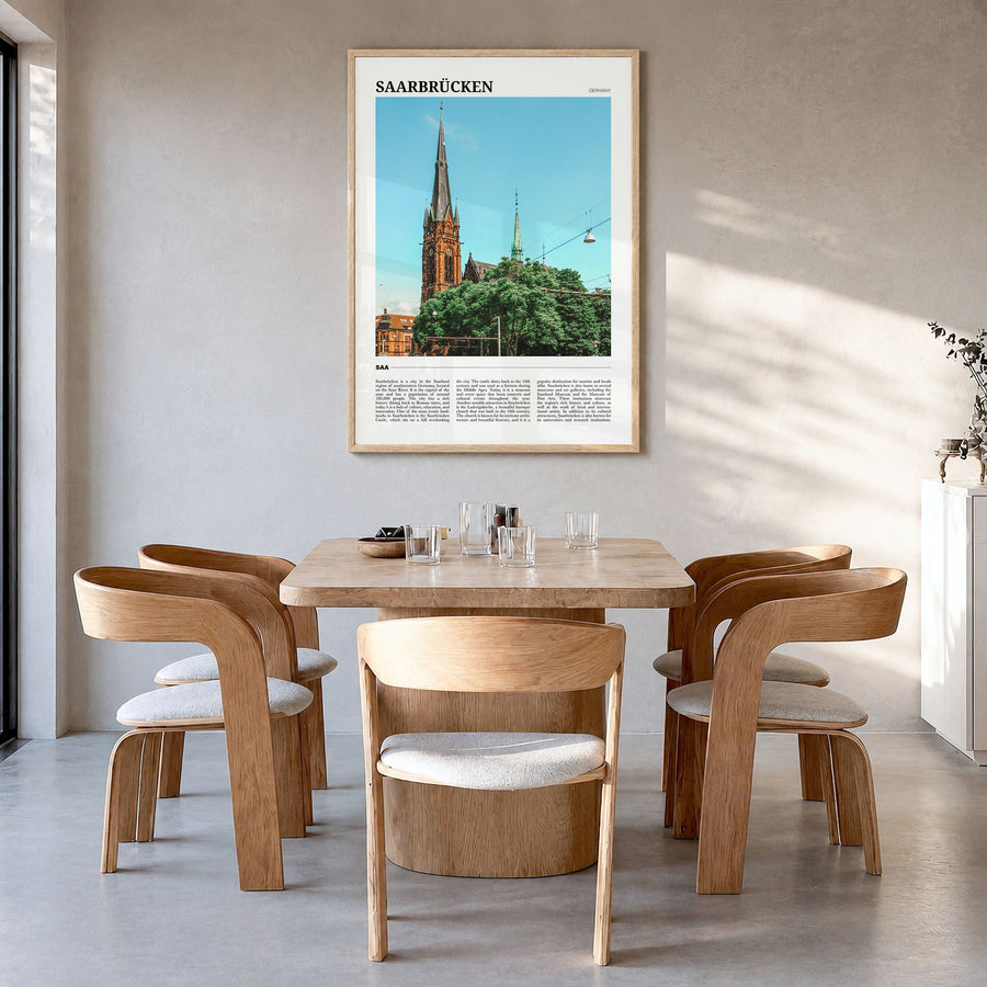 Saarbrücken Travel Poster in a natural wood frame, hanging in a dining room