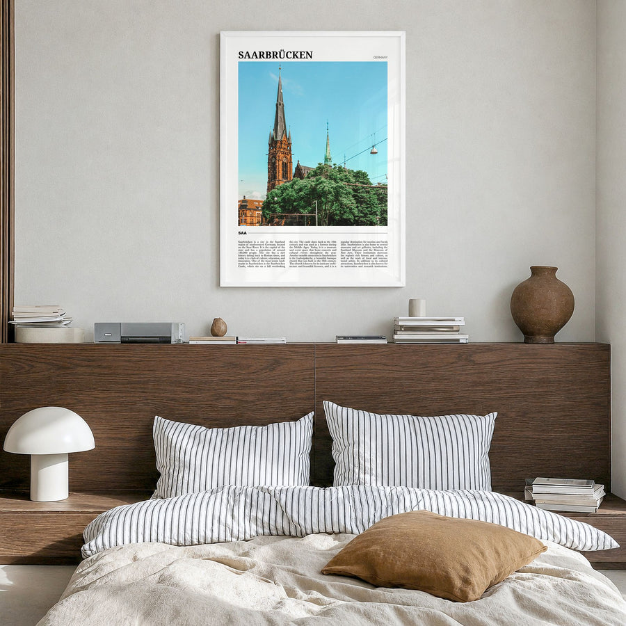 Saarbrücken Travel Poster in a white wood frame, hanging in a bedroom
