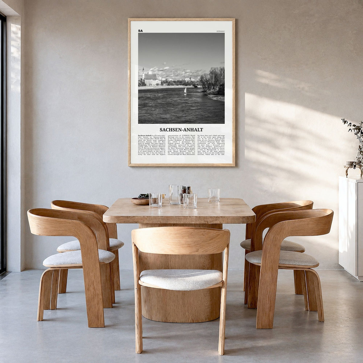 Sachsen-Anhalt Newspaper Poster in a natural wood frame, hanging in a dining room