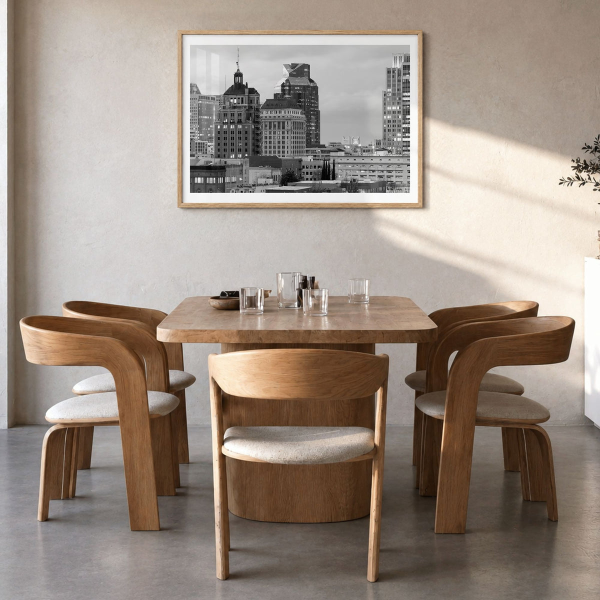 Sacramento Photo Poster in a natural wood frame, hanging in a dining room, white border