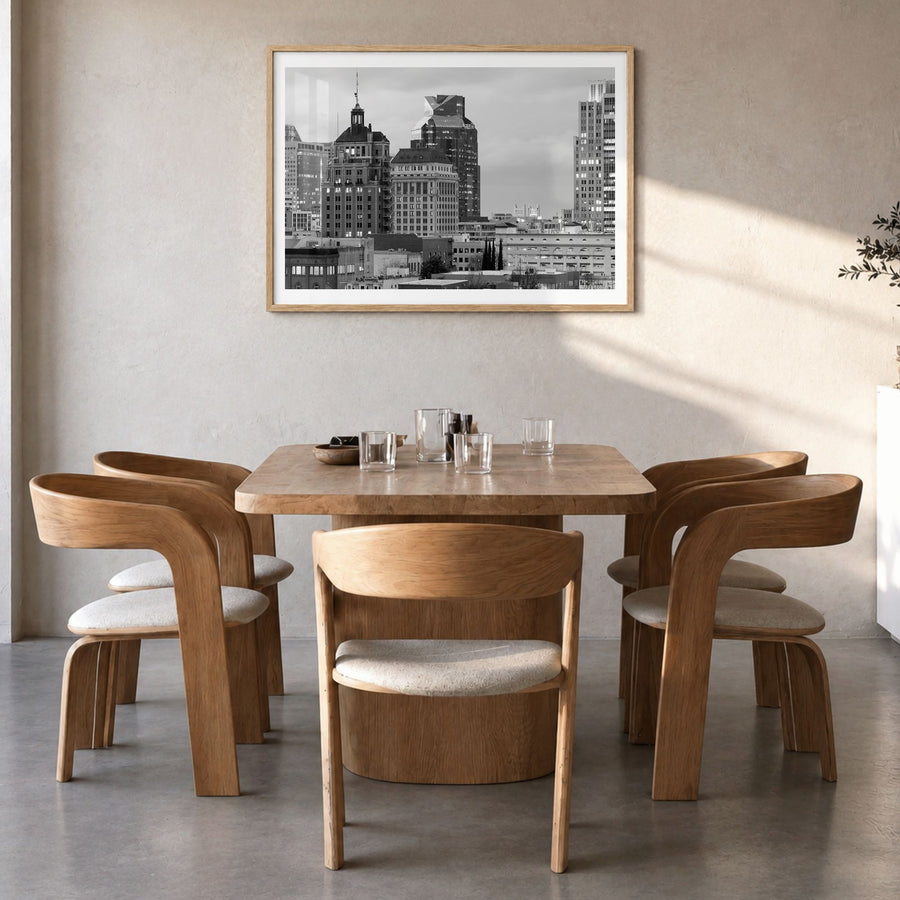 Sacramento Photo Poster in a natural wood frame, hanging in a dining room, white border