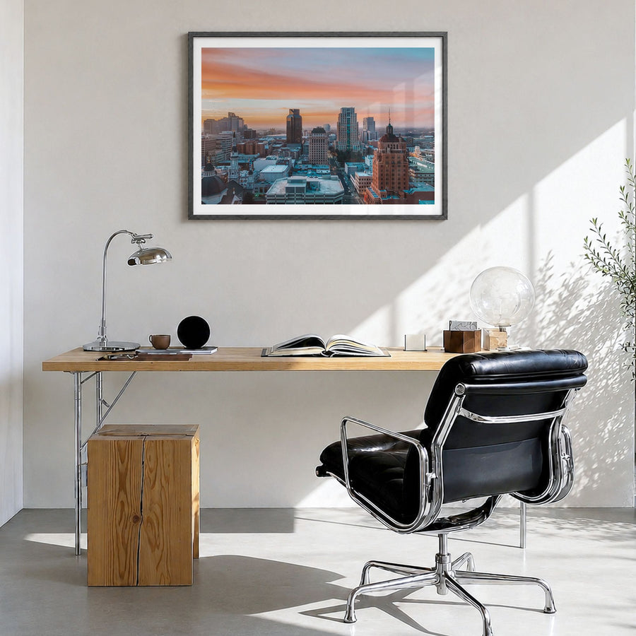 Sacramento Photo Poster in a black wood frame, hanging in a bright home office, white border