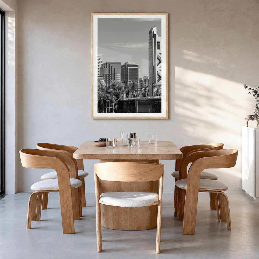 Sacramento Photo Poster in a natural wood frame, hanging in a dining room, white border