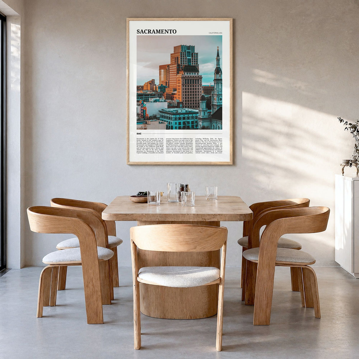 Sacramento Travel Poster in a natural wood frame, hanging in a dining room