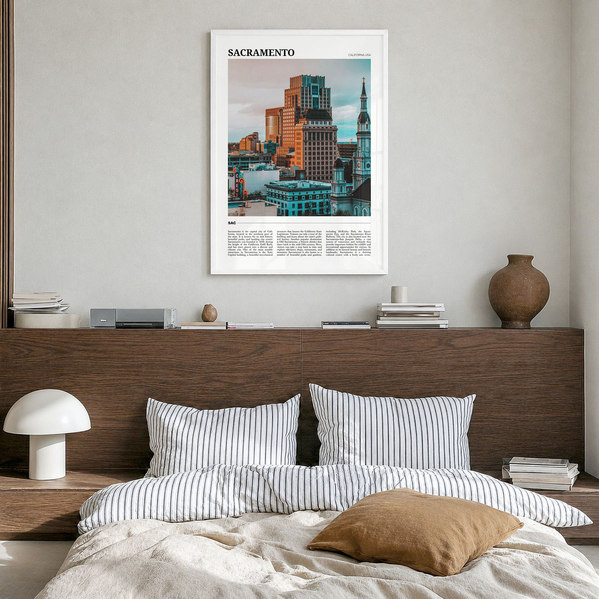 Sacramento Travel Poster in a white wood frame, hanging in a bedroom