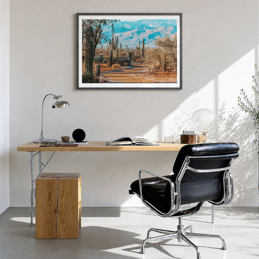 Saguaro National Park Photo Poster in a black wood frame, hanging in a bright home office, white border