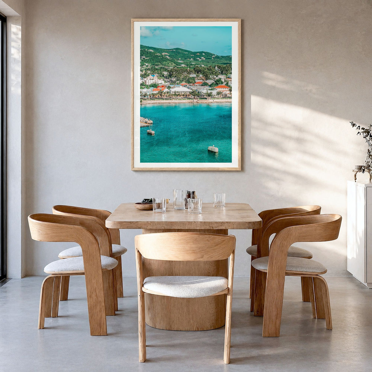 Saint Croix Photo Poster in a natural wood frame, hanging in a dining room, white border