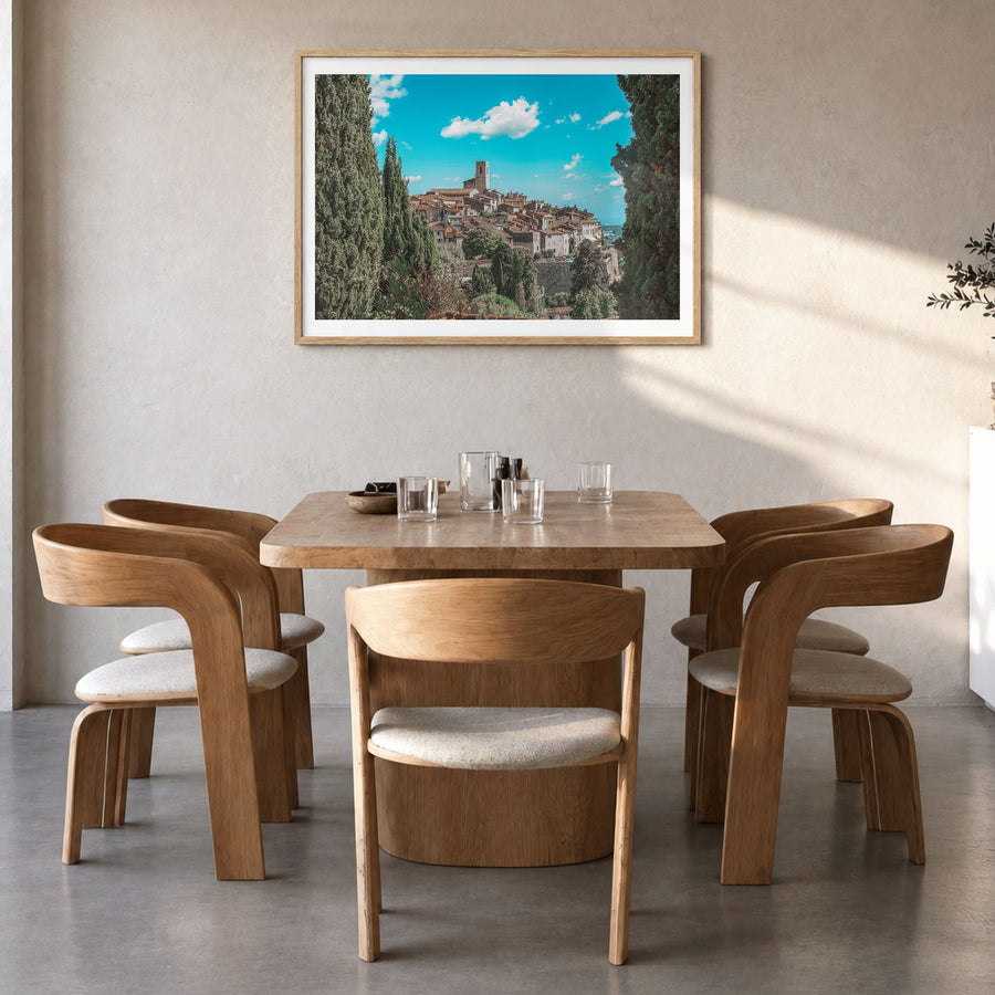 Saint Paul Photo Poster in a natural wood frame, hanging in a dining room, white border