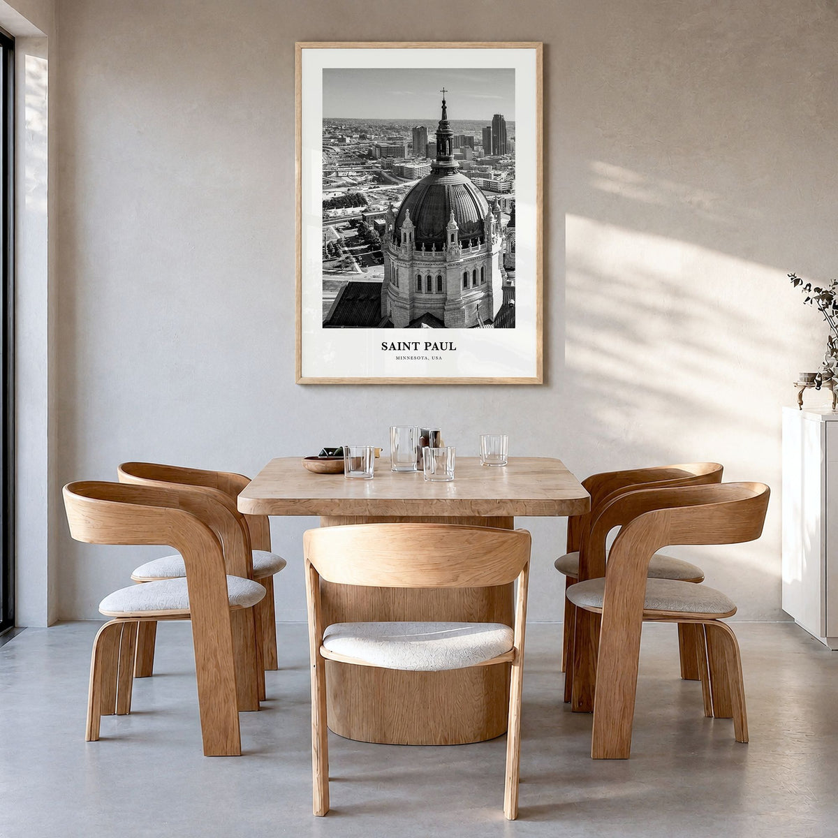 Saint Paul Classic Poster in a natural wood frame, hanging in a dining room