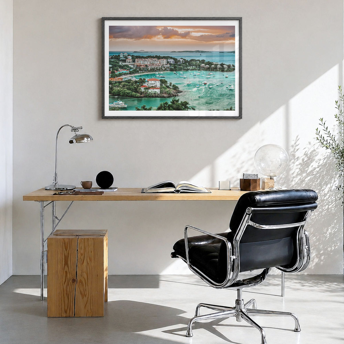 Saint Thomas Photo Poster in a black wood frame, hanging in a bright home office, white border