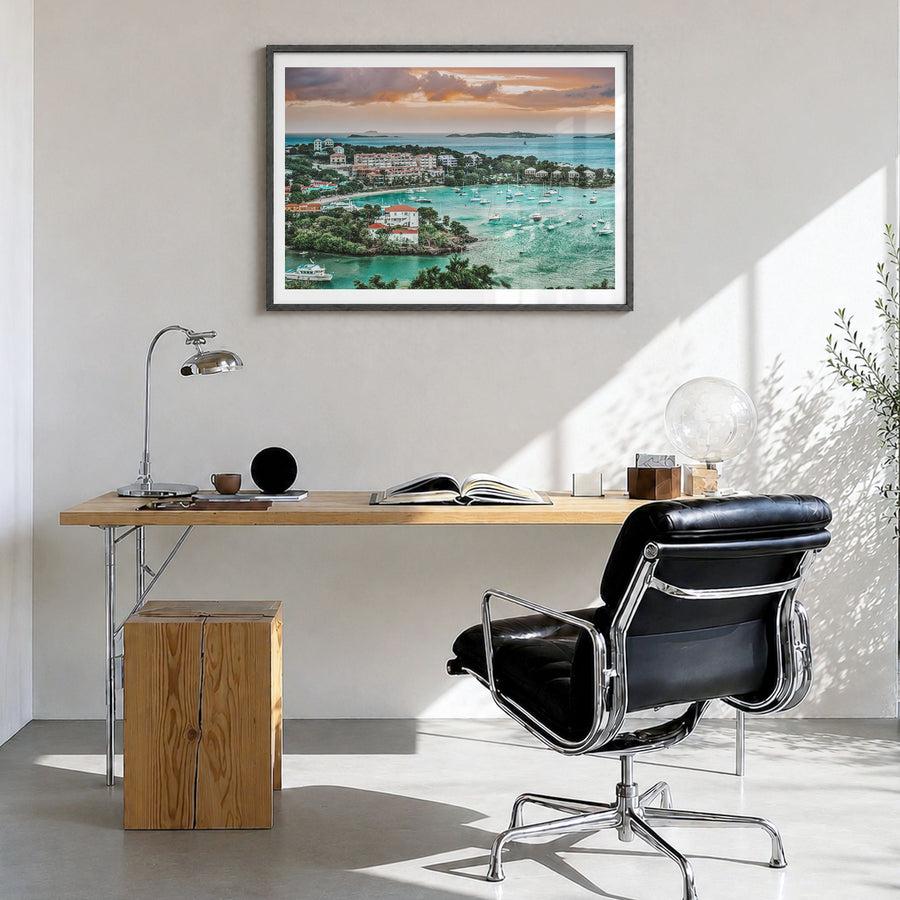 Saint Thomas Photo Poster in a black wood frame, hanging in a bright home office, white border