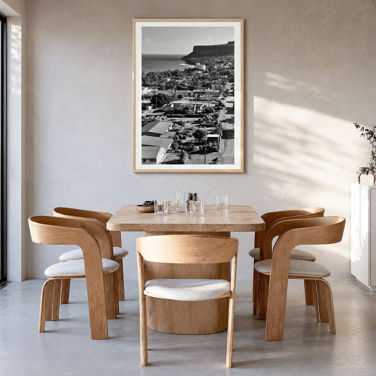 Saipan Photo Poster in a natural wood frame, hanging in a dining room, white border