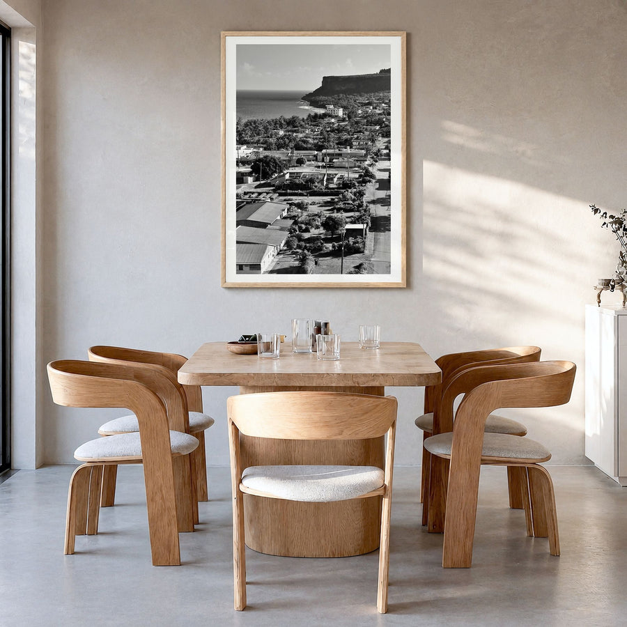 Saipan Photo Poster in a natural wood frame, hanging in a dining room, white border