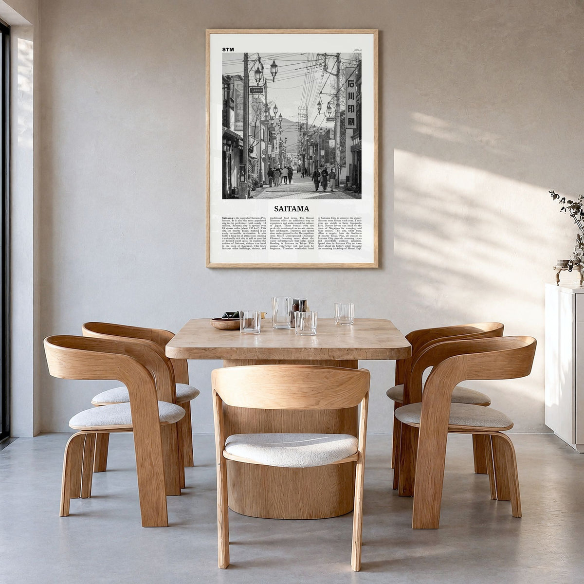 Saitama Newspaper Poster in a natural wood frame, hanging in a dining room