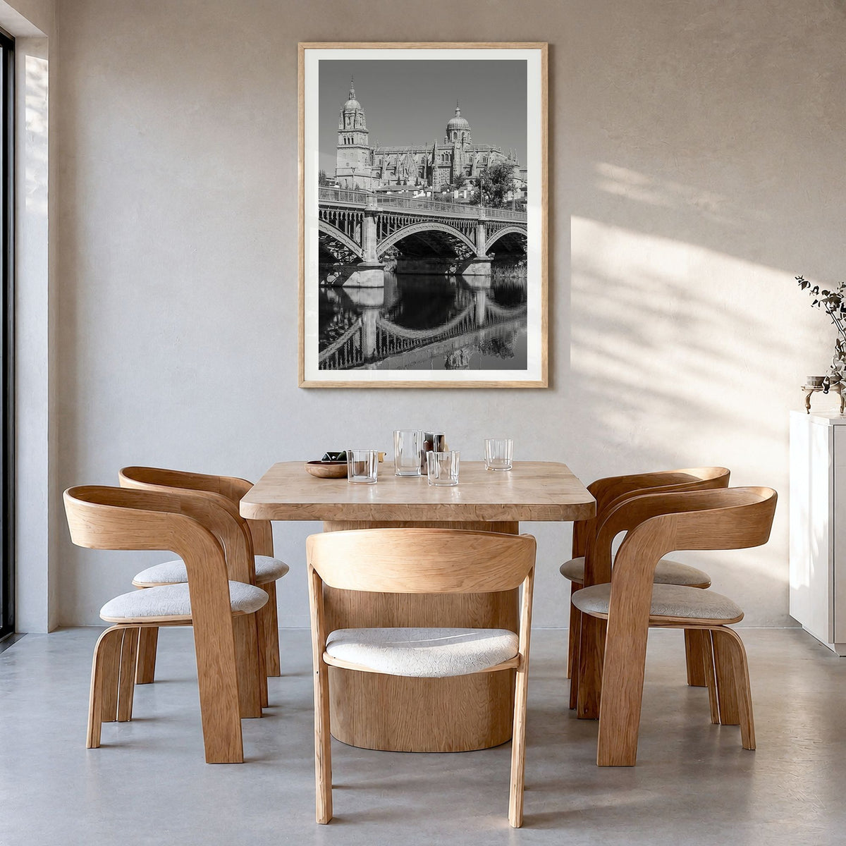 Salamanca Photo Poster in a natural wood frame, hanging in a dining room, white border