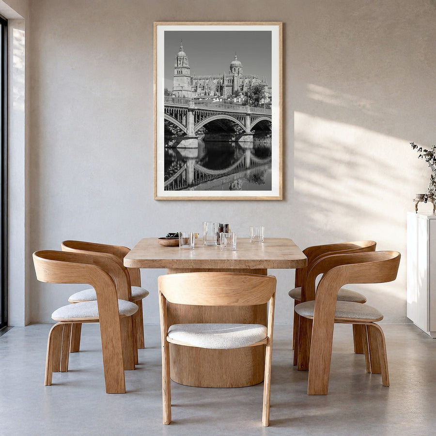 Salamanca Photo Poster in a natural wood frame, hanging in a dining room, white border