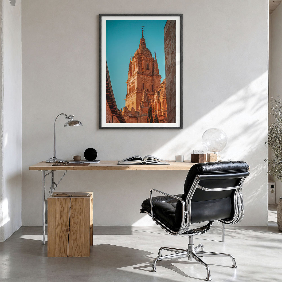Salamanca Photo Poster in a black wood frame, hanging in a bright home office, white border