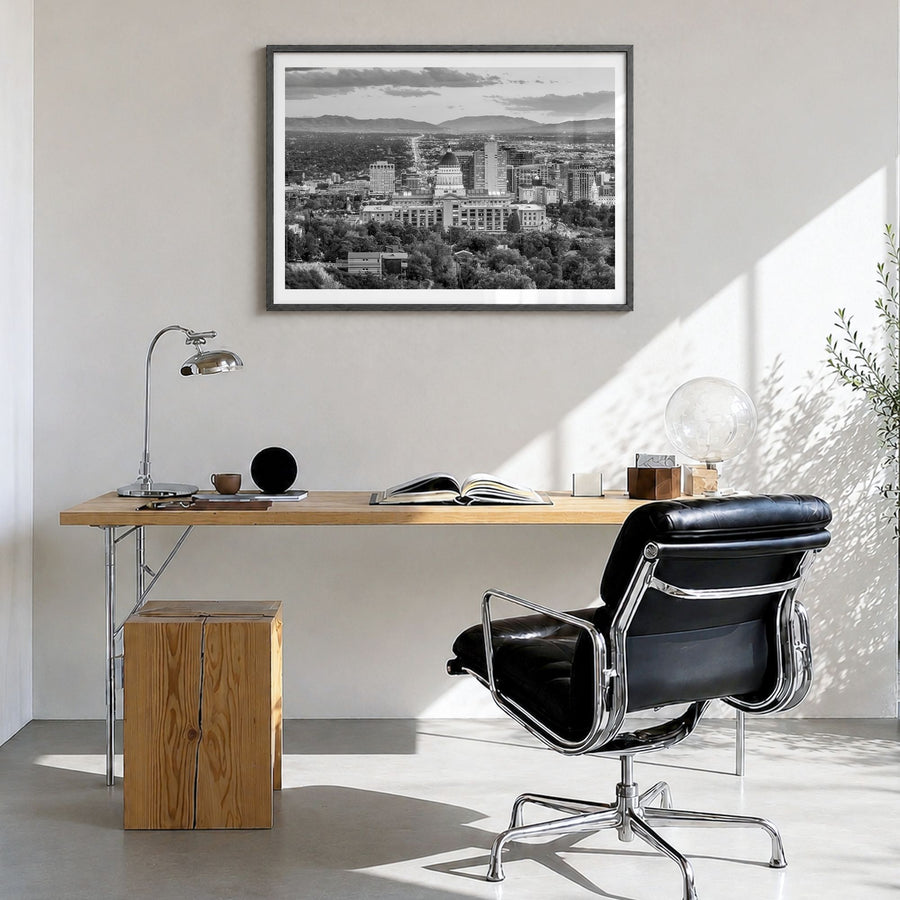 Salt Lake City Photo Poster in a black wood frame, hanging in a bright home office, white border