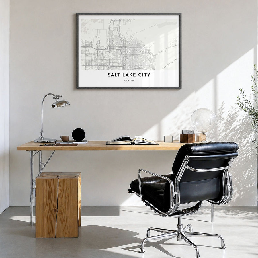 Salt Lake City Map Poster in a black wood frame, hanging in a bright home office
