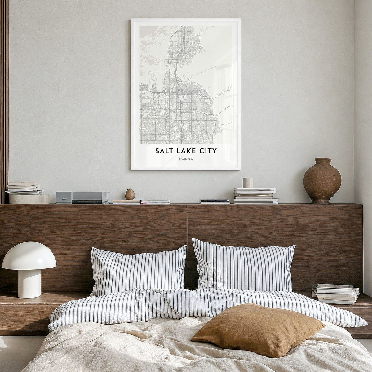 Salt Lake City Map Poster in a white wood frame, hanging in a bedroom