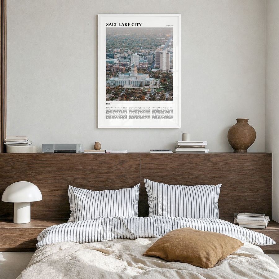 Salt Lake City Travel Poster in a white wood frame, hanging in a bedroom