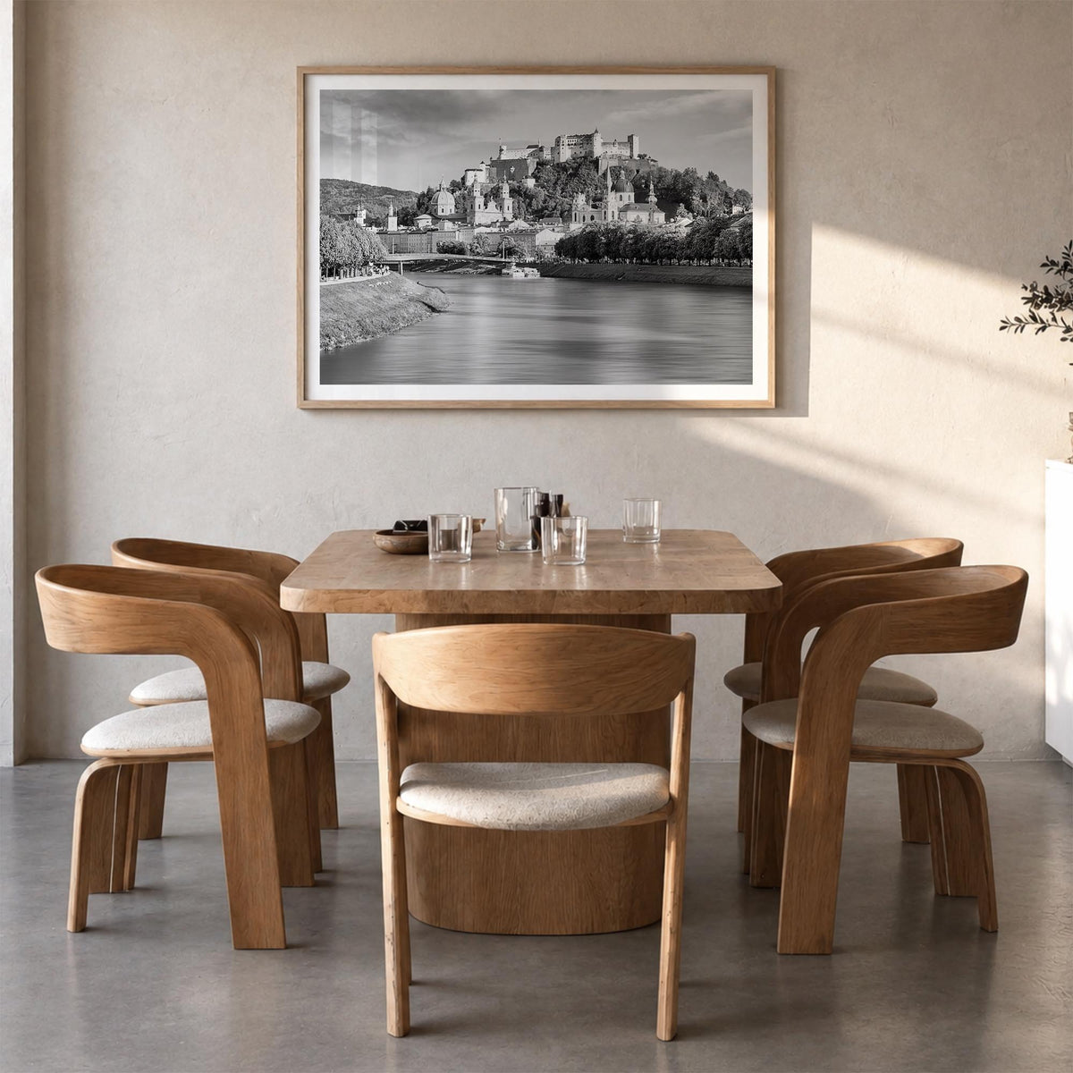 Salzburg black & white photo poster of Austria – horizontal wall art in natural wood frame with white border, hanging on wall