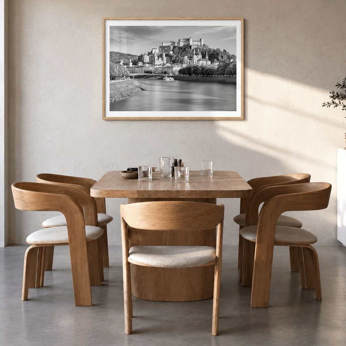 Salzburg Photo Poster in a natural wood frame, hanging in a dining room, white border