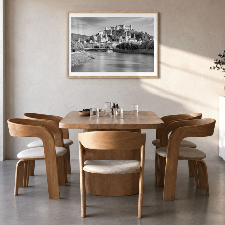 Salzburg Photo Poster in a natural wood frame, hanging in a dining room, white border
