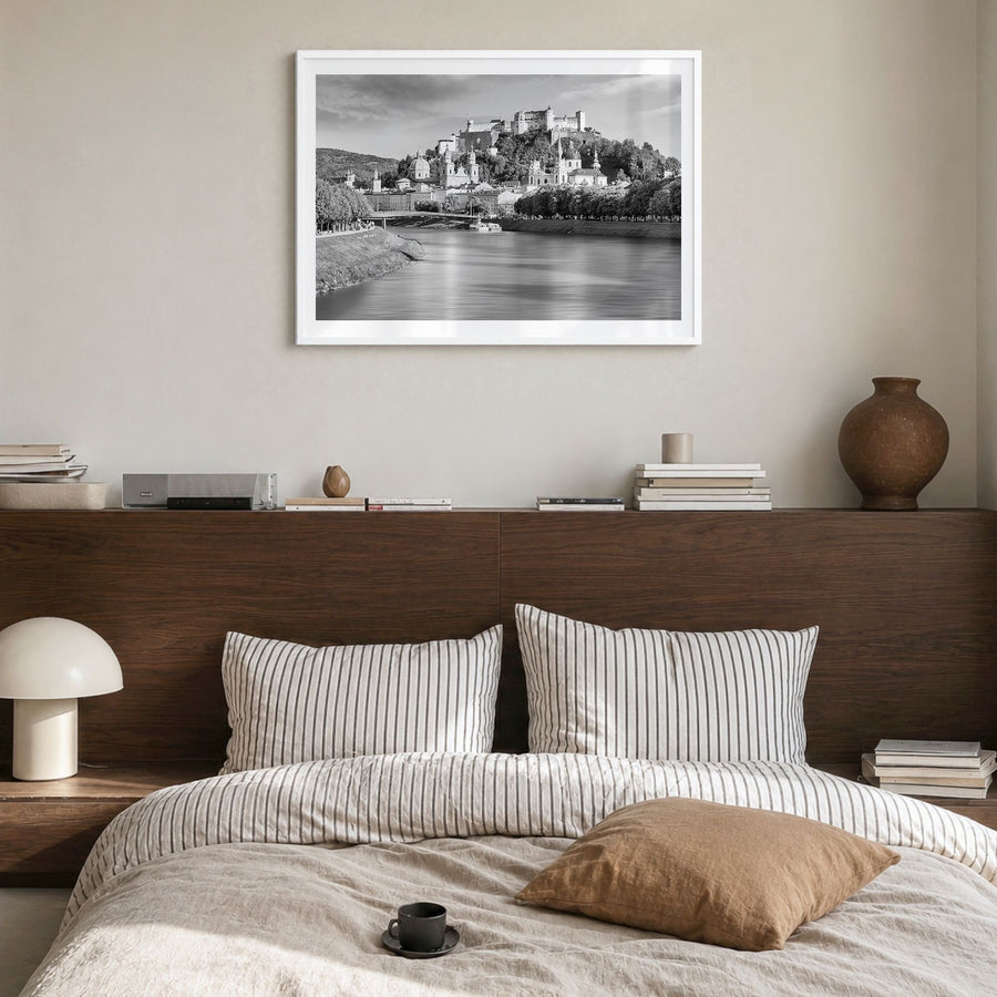 Salzburg Photo Poster in a white wood frame, hanging in a bedroom, white border