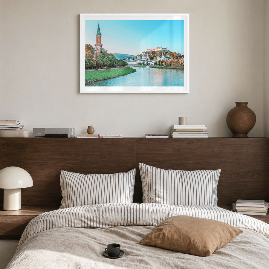 Salzburg Photo Poster in a white wood frame, hanging in a bedroom, white border