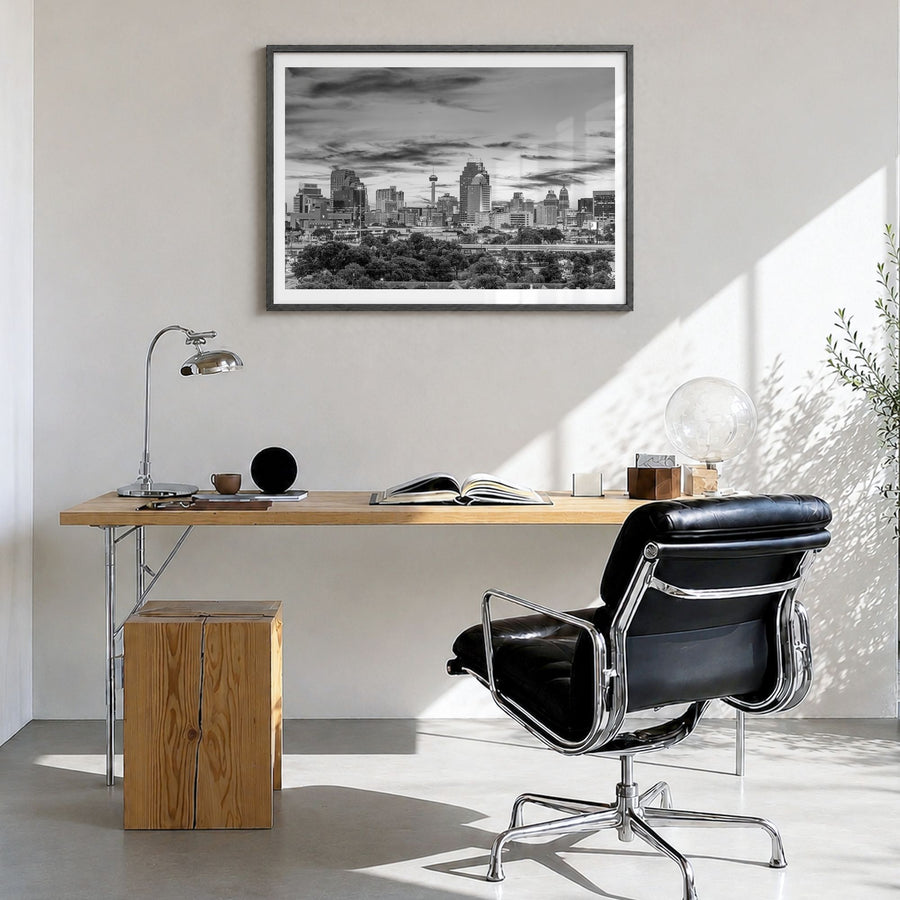 San Antonio Photo Poster in a black wood frame, hanging in a bright home office, white border