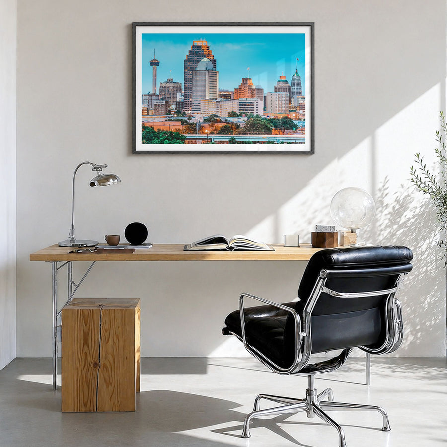 San Antonio Photo Poster in a black wood frame, hanging in a bright home office, white border
