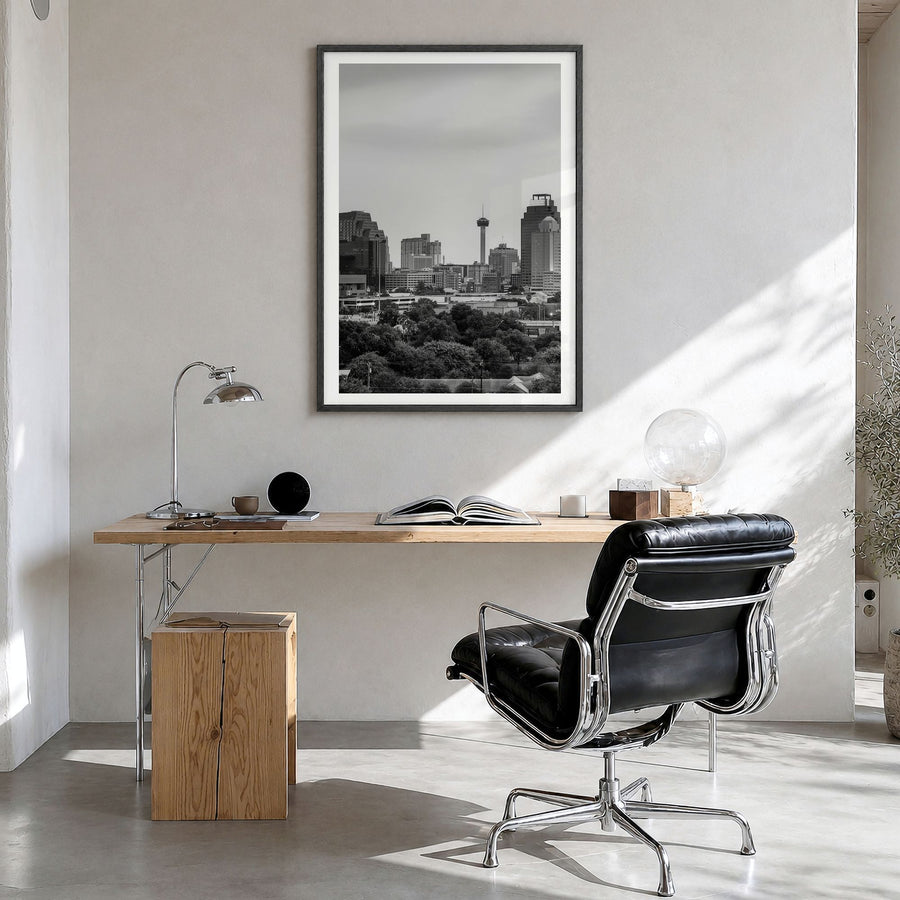 San Antonio Photo Poster in a black wood frame, hanging in a bright home office, white border