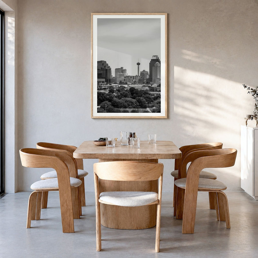 San Antonio Photo Poster in a natural wood frame, hanging in a dining room, white border