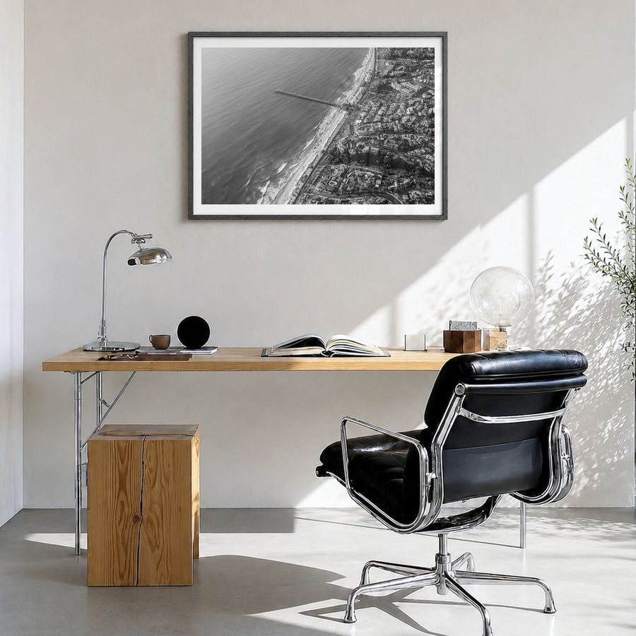 San Clemente Photo Poster in a black wood frame, hanging in a bright home office, white border