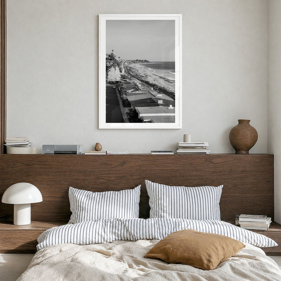 San Clemente Photo Poster in a white wood frame, hanging in a bedroom, white border