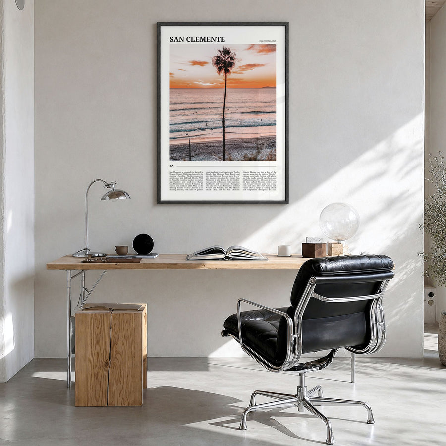 San Clemente Travel Poster in a black wood frame, hanging in a bright home office