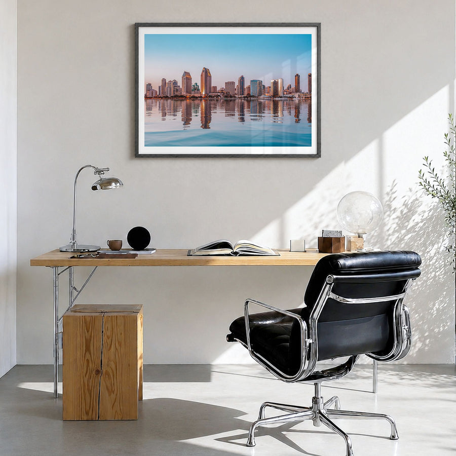 San Diego Photo Poster in a black wood frame, hanging in a bright home office, white border