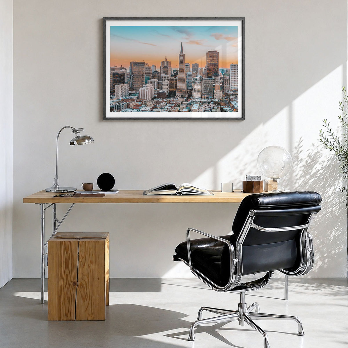 San Francisco Photo Poster in a black wood frame, hanging in a bright home office, white border