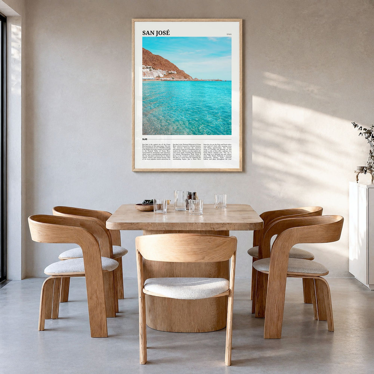 San José, Spain Travel Poster in a natural wood frame, hanging in a dining room