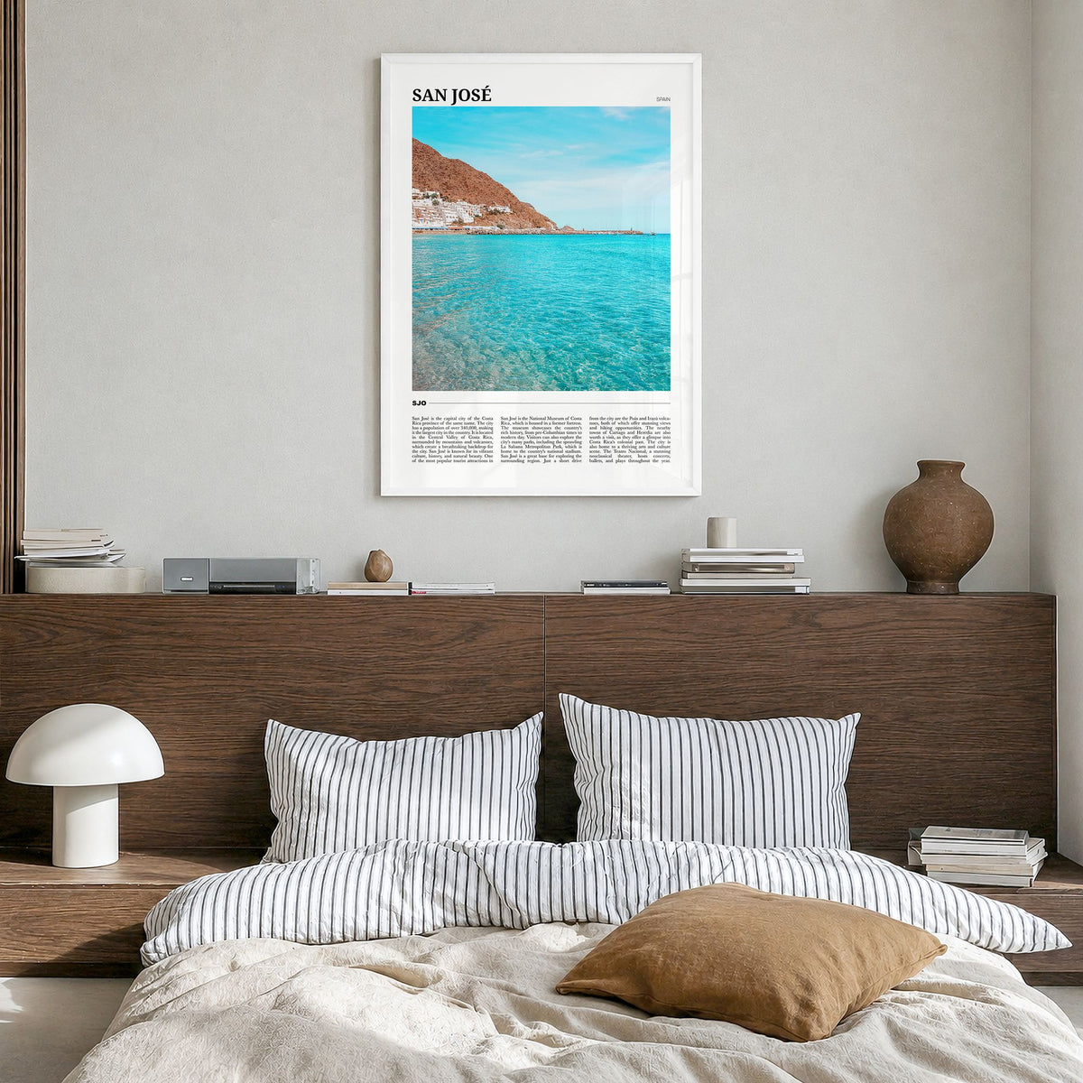 San José, Spain Travel Poster in a white wood frame, hanging in a bedroom