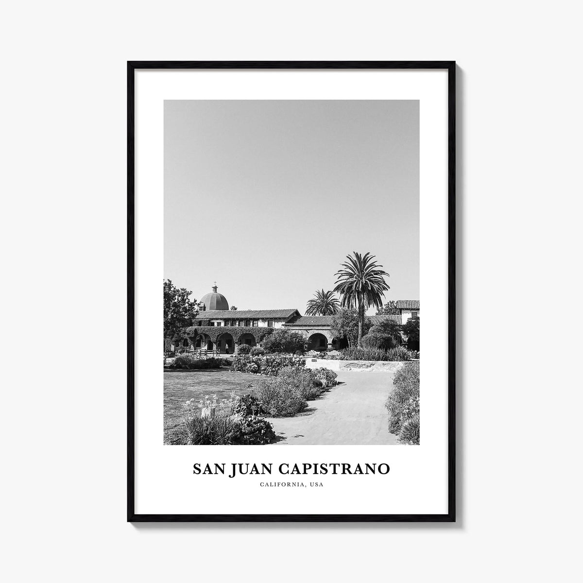 San Juan Capistrano black & white classic poster of California, USA – vertical wall art, unframed print shown in interior moc
