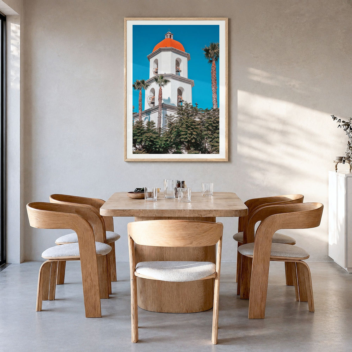 San Juan Capistrano Photo Poster in a natural wood frame, hanging in a dining room, white border