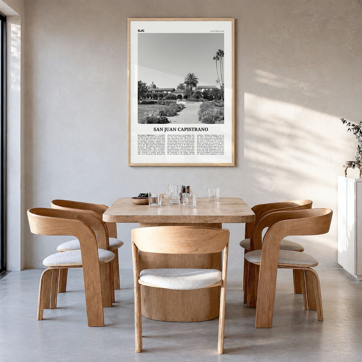 San Juan Capistrano Newspaper Poster in a natural wood frame, hanging in a dining room