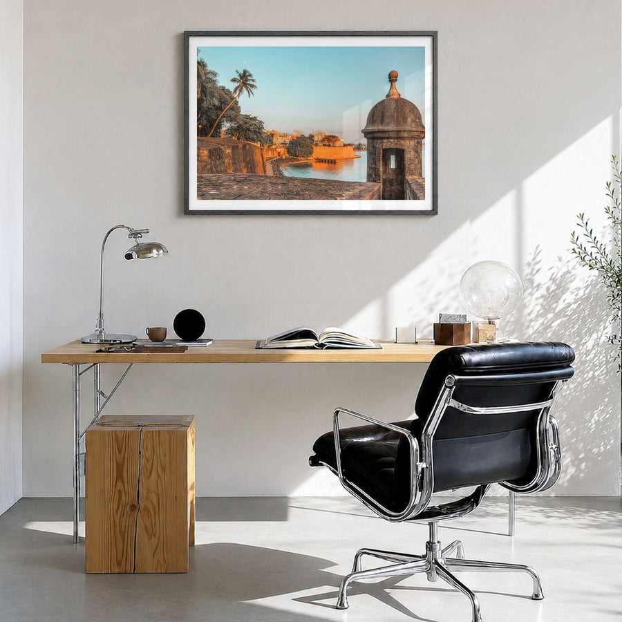 San Juan Photo Poster in a black wood frame, hanging in a bright home office, white border