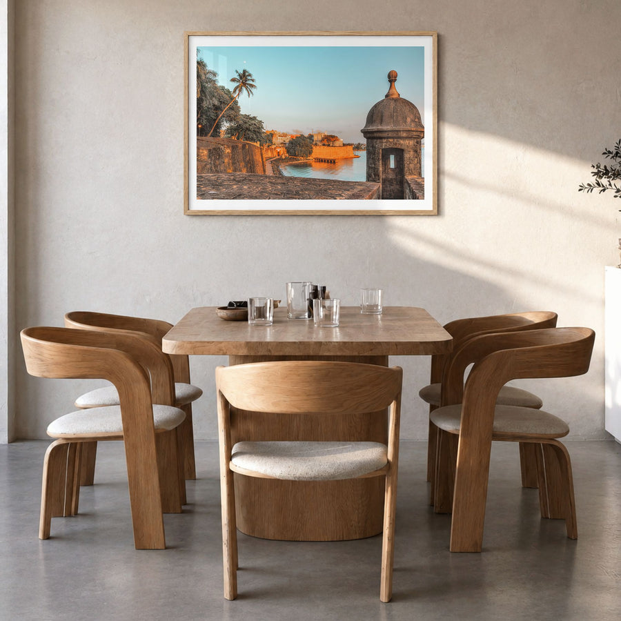San Juan Photo Poster in a natural wood frame, hanging in a dining room, white border