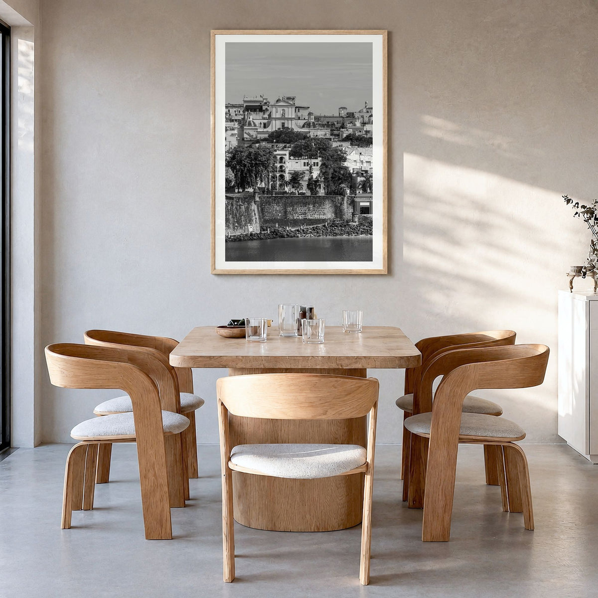 San Juan Photo Poster in a natural wood frame, hanging in a dining room, white border