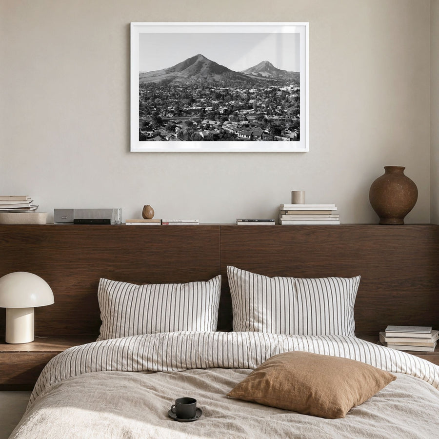 San Luis Obispo Photo Poster in a white wood frame, hanging in a bedroom, white border