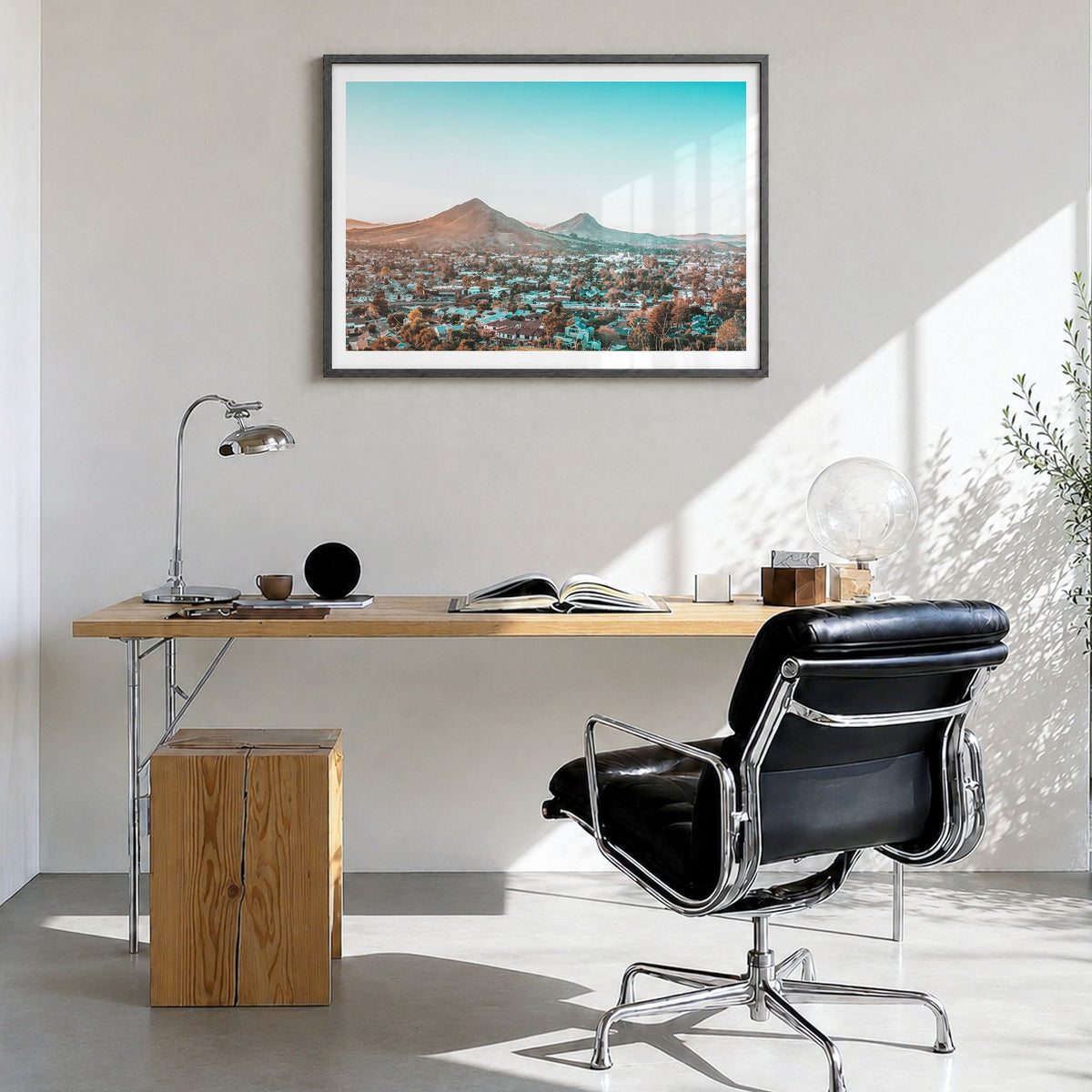 San Luis Obispo Photo Poster in a black wood frame, hanging in a bright home office, white border