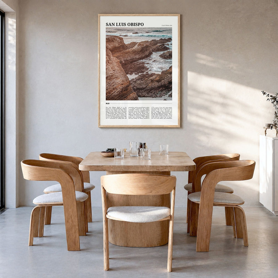 San Luis Obispo Travel No 1 Poster in a natural wood frame, hanging in a dining room